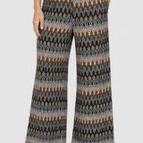 Pantaloni damă evazați cu imprimeu geometric multicolor
